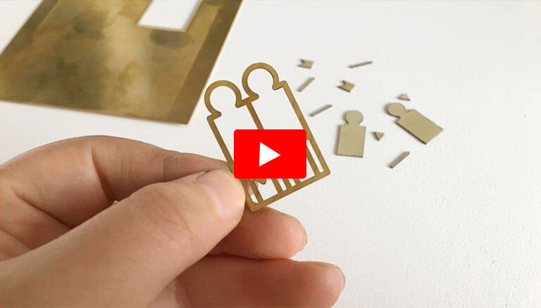 laser cutting machine cuts brass pattern-